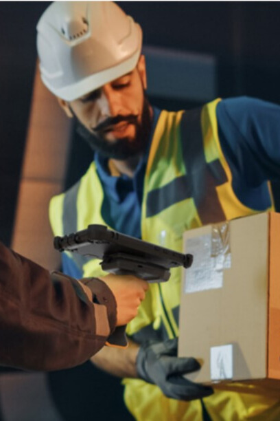 person holding box being scanned