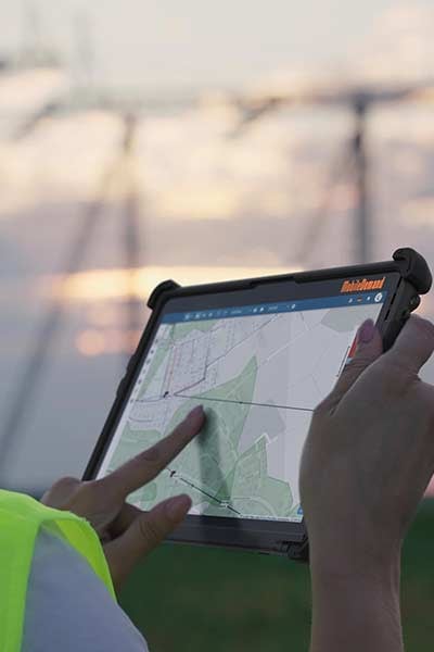 An electrical worker uses the T1110 Rugged Tablet