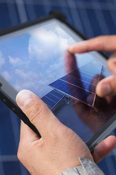 An ipad being used in a solar farm