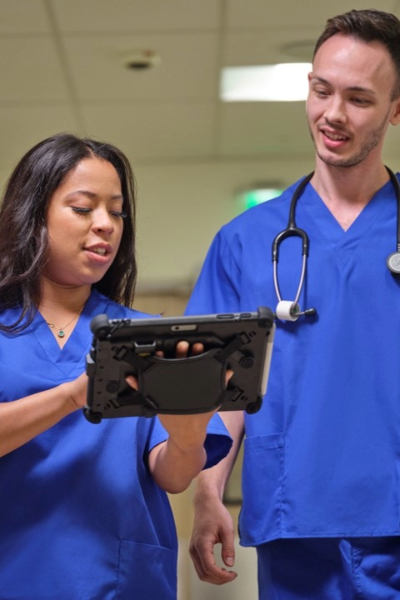 healthcare workers holding rugged surface device