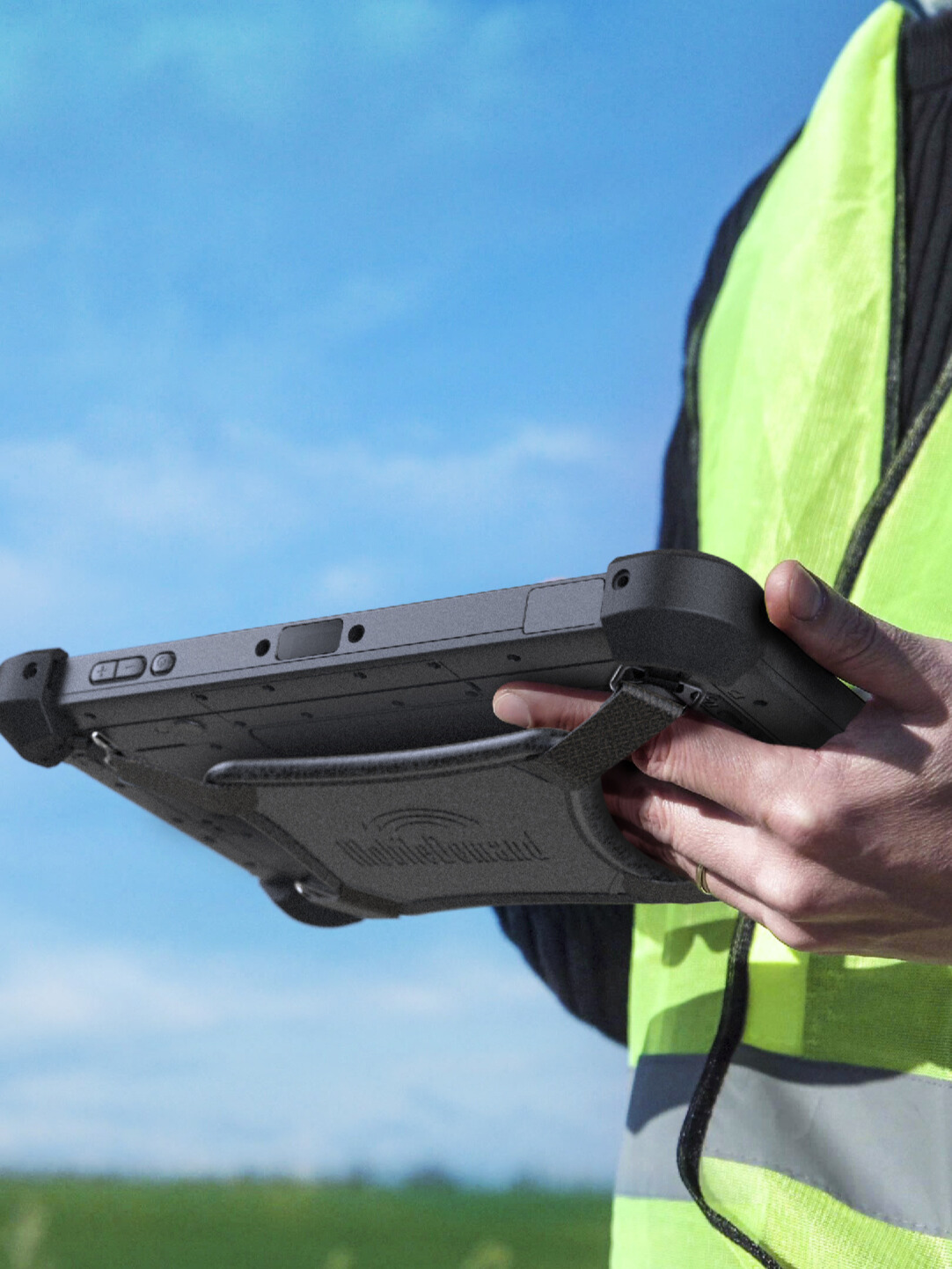 person holding rugged tablet outside