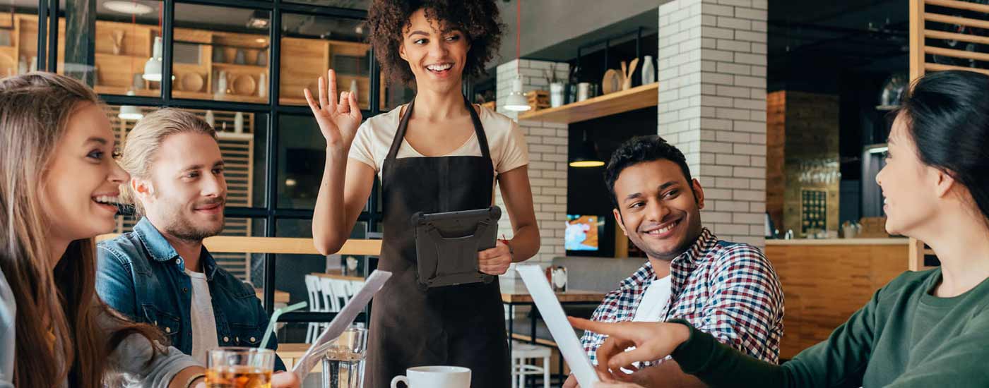 A server uses a rugged tablet case to take an order