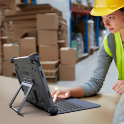 Female worker in warehouse using rugged xtablet flex 12b