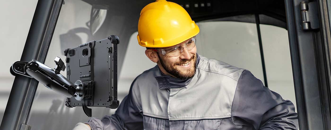 Man in forklift with rugged tablet