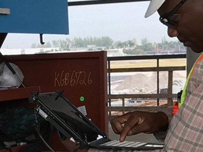 construction worker holding rugged tablet