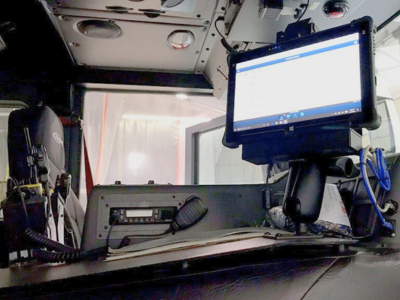 rugged tablet mounted in police squad car