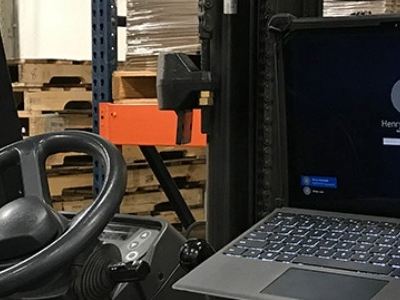 rugged surface tablet with keyboard mounted on a forklift