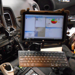 rugged tablet with keyboard mounted in police patrol car